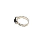 Side view of the 12 x 10 mm garnet stone with a handmade fine silver band and sterling silver setting