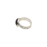 Side view of the 12 x 10 mm garnet stone with a handmade fine silver band and sterling silver setting