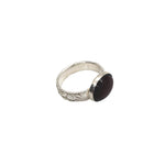 Handmade pure silver January birthstone ring with a nature inspired patterned band and sterling silver stone setting
