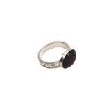 Handmade pure silver January birthstone ring with a nature inspired patterned band and sterling silver stone setting